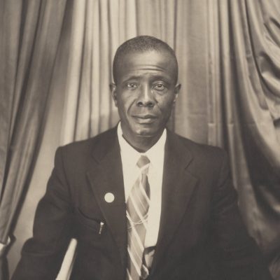 Portrait of an African American man with a somber but hopeful expression